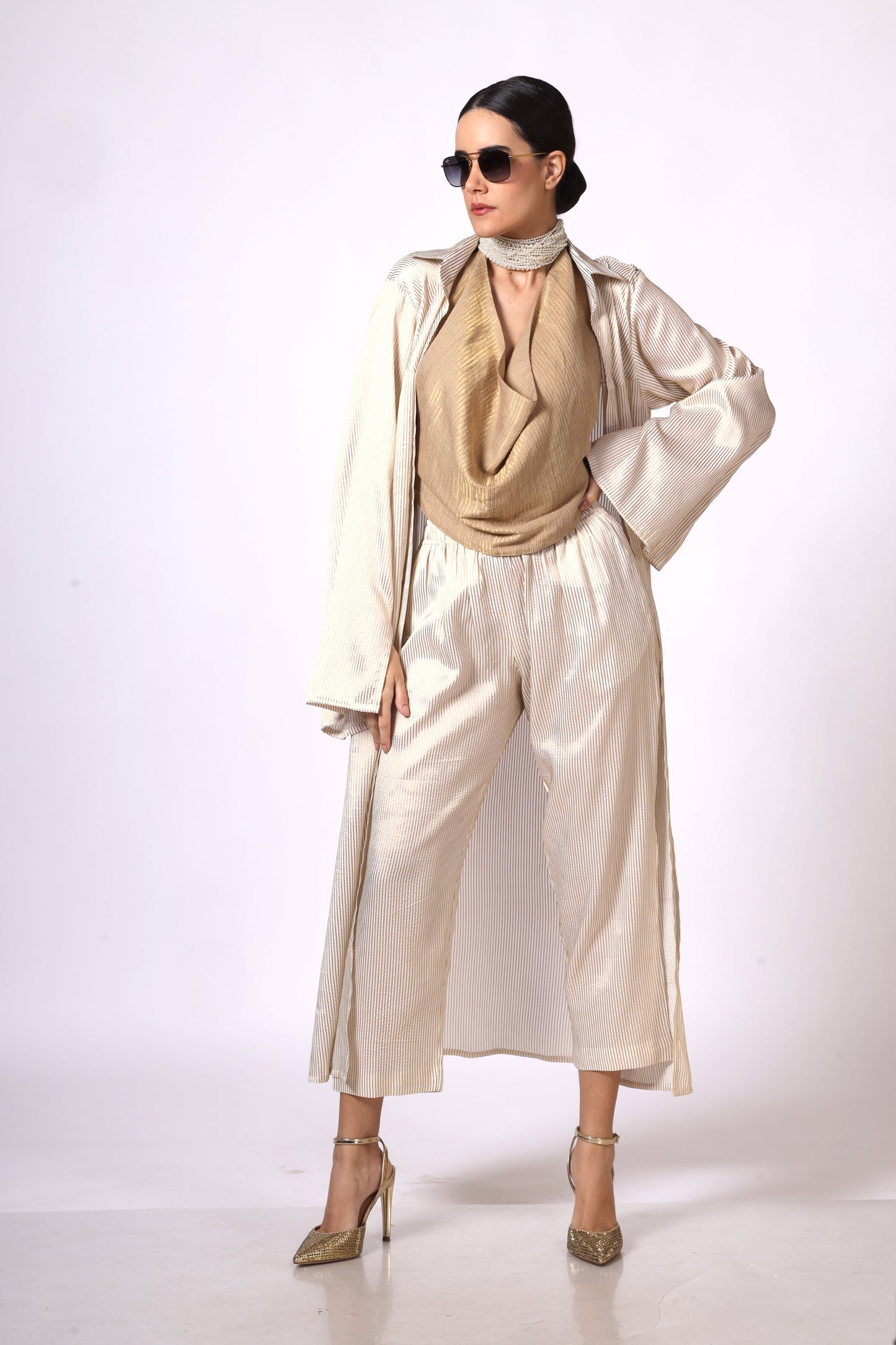 Cream and gold pinstripe jacket with hand embroidered motif on cuff
