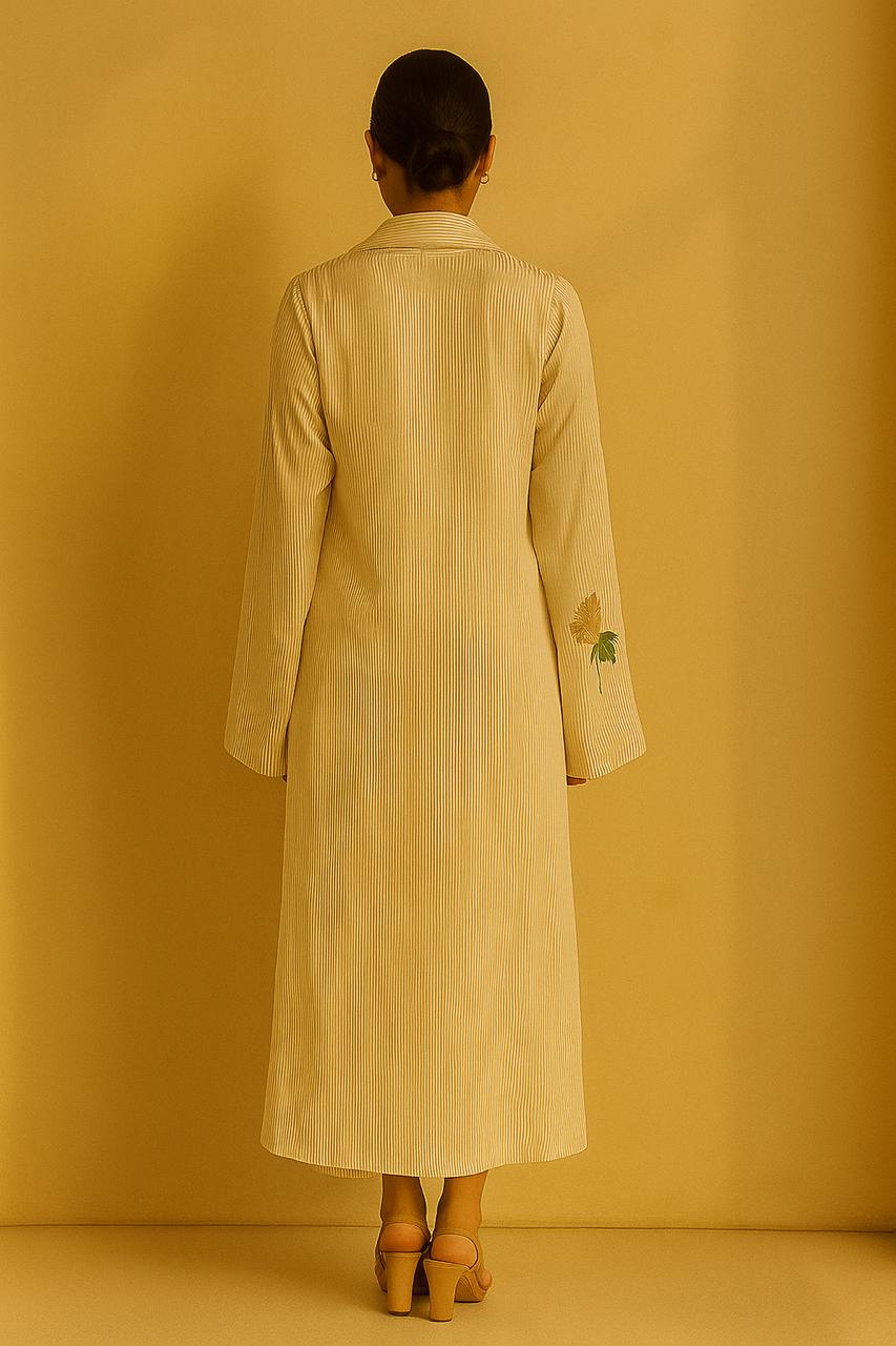 Cream and gold pinstripe jacket, top and pant. Embroidered motif on cuffs.