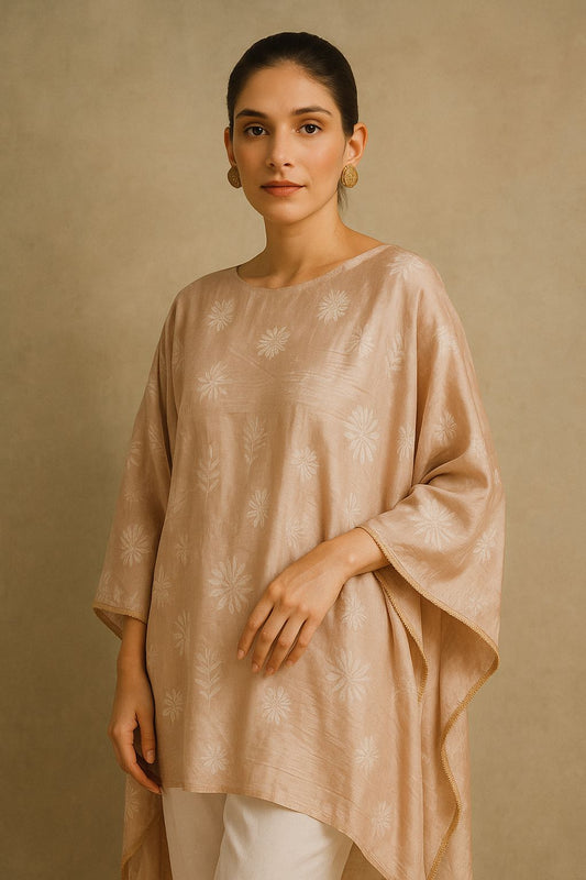 Light pinkish beige silk wrap / throw with all over Chikankari hand embroidery and finished with beaded tassels