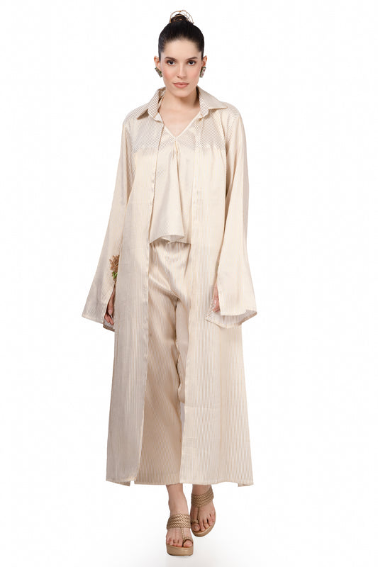 Cream and gold pinstripe jacket, top and pant with hand embroidered motif on cuff