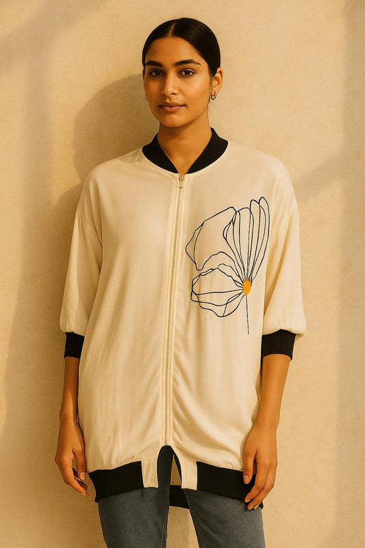 Shirt jacket in bamboo crepe with a wild peony print on the front in black & yellow. Cuff in gold and black weave.