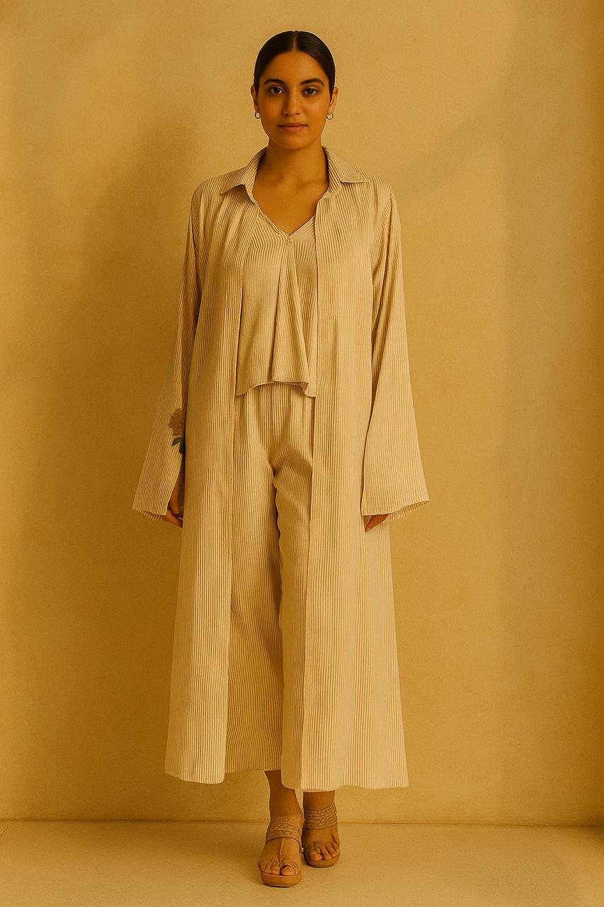 Cream and gold pinstripe jacket, top and pant.  Embroidered motif on cuffs.