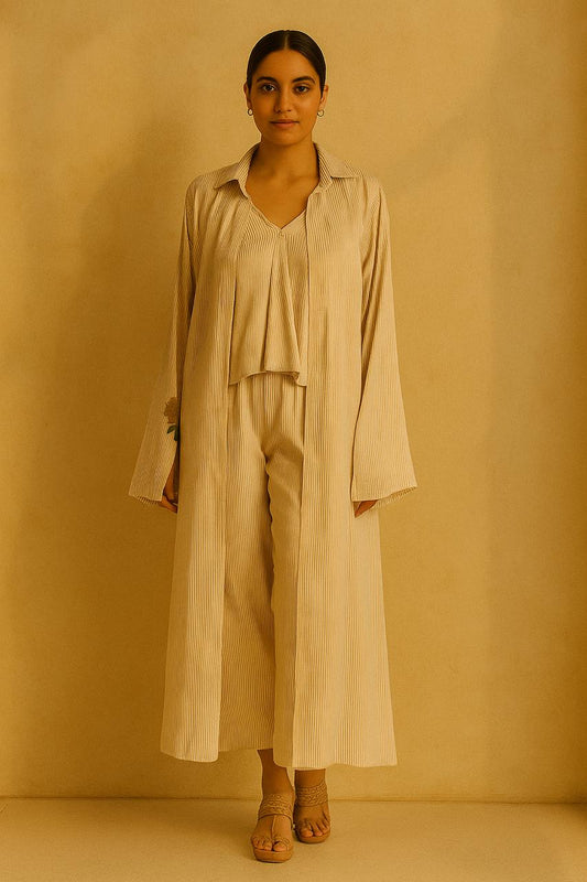 Cream and gold pinstripe jacket, top and pant.  Embroidered motif on cuffs.