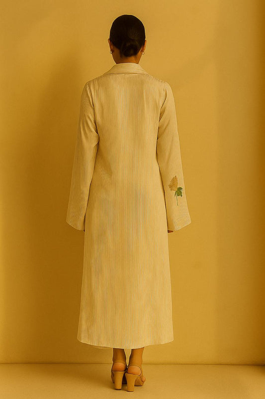 Cream and gold pinstripe jacket, top and pant.  Embroidered motif on cuffs.