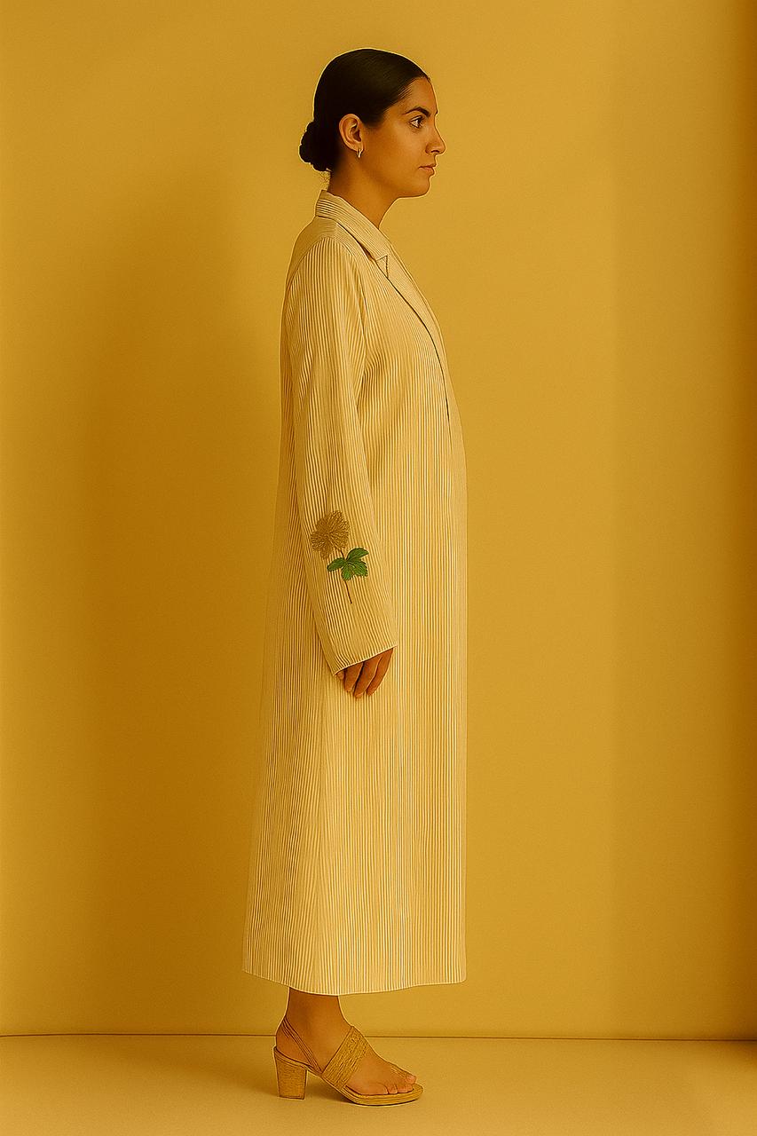 Cream and gold pinstripe jacket, top and pant.  Embroidered motif on cuffs.