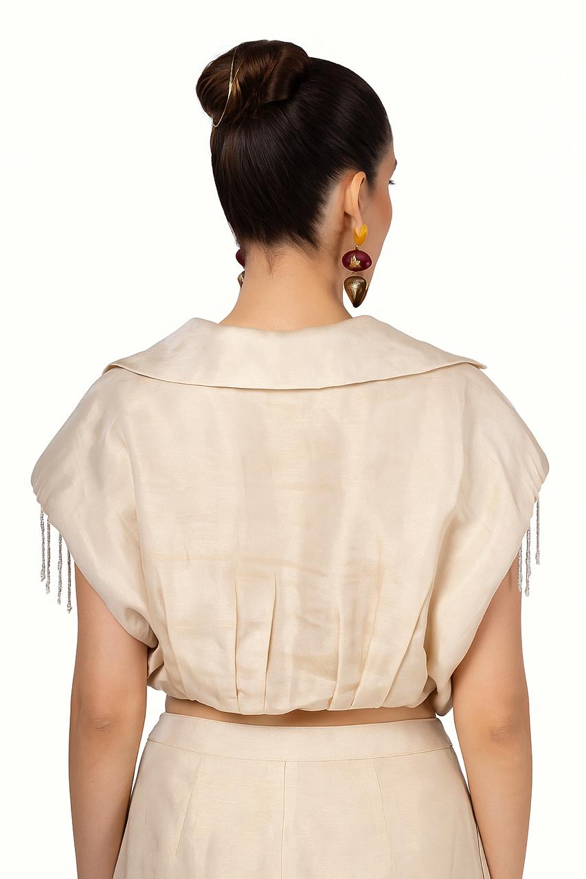 Cream-Gold crop jacket with shoulder pads & beaded tassel sleeves